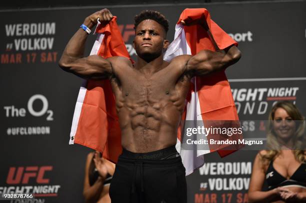 Hakeem Dawodu of Canada poses on the scale during the UFC Fight Night weigh-in inside The O2 Arena on March 16, 2018 in London, England.