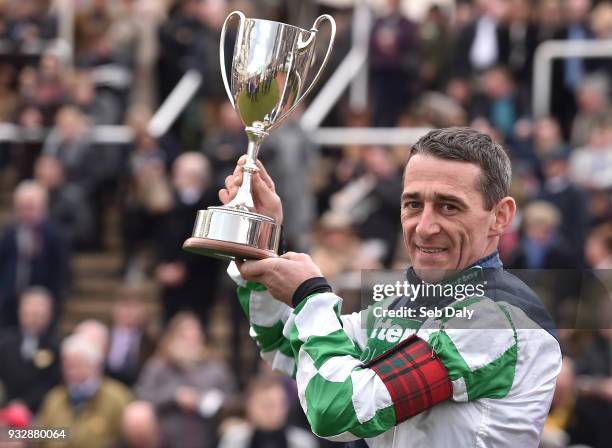 Cheltenham , United Kingdom - 16 March 2018; Leading jockey of the 2018 Cheltenham Festival Davy Russell celebrates with the cup during Day Four of...