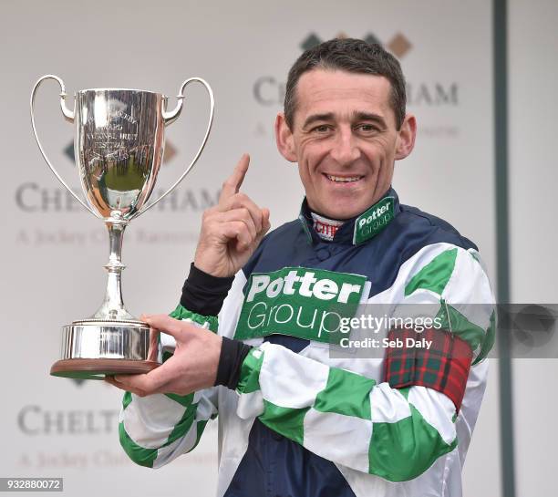 Cheltenham , United Kingdom - 16 March 2018; Leading jockey of the 2018 Cheltenham Festival Davy Russell celebrates with the cup during Day Four of...