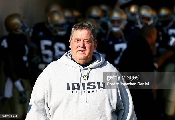 Head coach Charlie Weis of the Notre Dame Fighting Irish walks out of the tunnel before lining up to enter the field for a game against the...