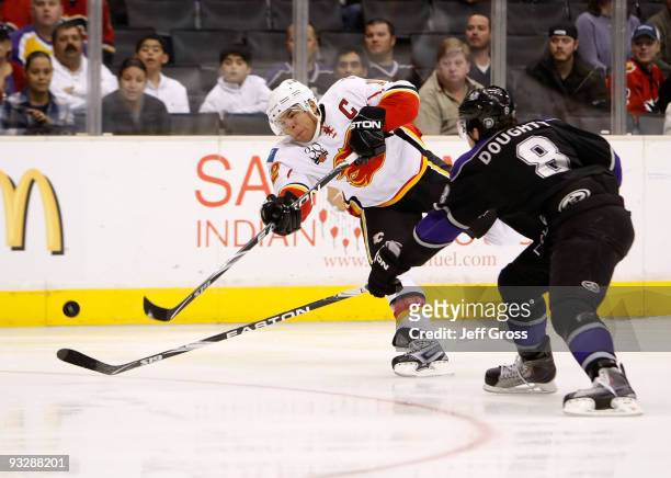 Jarome Iginla of the Calgary Flames shoots the puck past Drew Doughty of the Los Angeles Kings in the first period at Staples Center on November 21,...