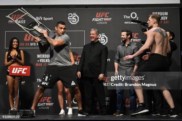 Fabricio Werdum of Brazil and Alexander Volkov of Russia face off during the UFC Fight Night weigh-in inside The O2 Arena on March 16, 2018 in...