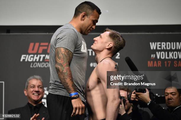 Fabricio Werdum of Brazil and Alexander Volkov of Russia face off during the UFC Fight Night weigh-in inside The O2 Arena on March 16, 2018 in...