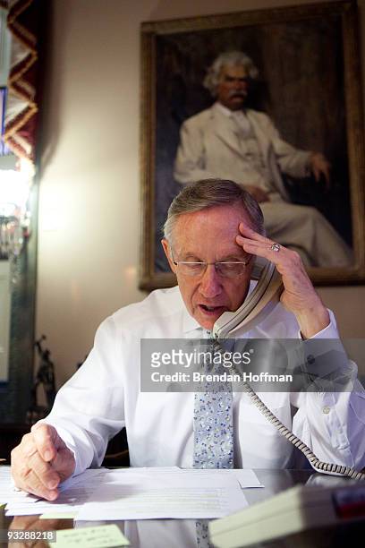 Senate Majority Leader Harry Reid talks with fellow Democratic Senators about their appearances on Sunday talk shows in his office on Capitol Hill on...