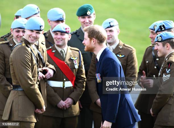 Prince Harry presents 12 pilots from Course 17/02 of the Army Air Corps with their Wings during a ceremony at Museum of Army Flying in Stockbridge,...
