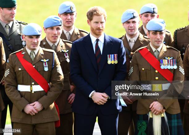 Prince Harry presents 12 pilots from Course 17/02 of the Army Air Corps with their Wings during a ceremony at Museum of Army Flying in Stockbridge,...