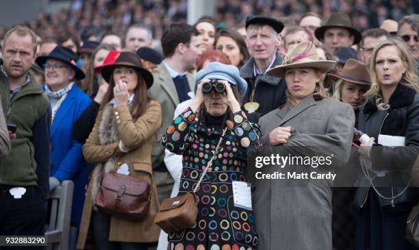 Racegoers react as they watch the racing in the Gold Cup at Cheltenham Racecourse on Gold Cup Day on March 16, 2018 in Cheltenham, England. Thousands...