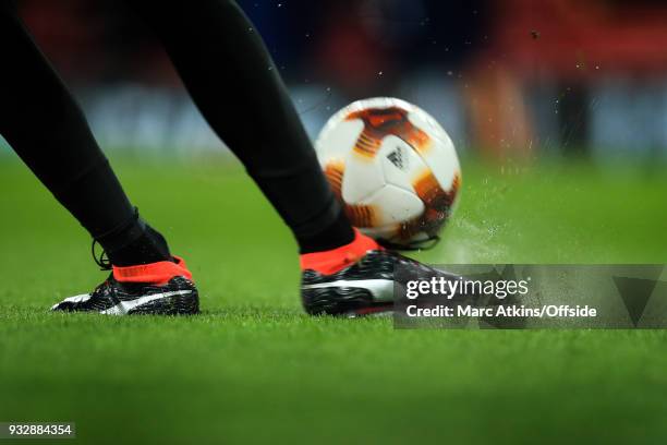 General view of player wearing Puma boots kicking the ball during the UEFA Europa League Round of 16 2nd leg match between Arsenal and AC MIian at...