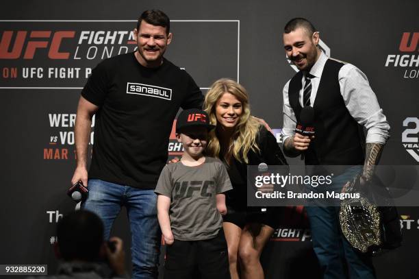 Middleweight Michael Bisping, UFC fan Marshall Jensen, UFC women's flyweight Paige VanZant and UFC commentator Dan Hardy pose for a photo during a...