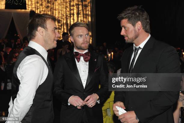 Gary Barlow of Take That talks to Ronan Keating and Keith Duffy of Boyzone at Ronan Keating's fourth annual Emeralds and Ivy Ball in aid of Cancer...