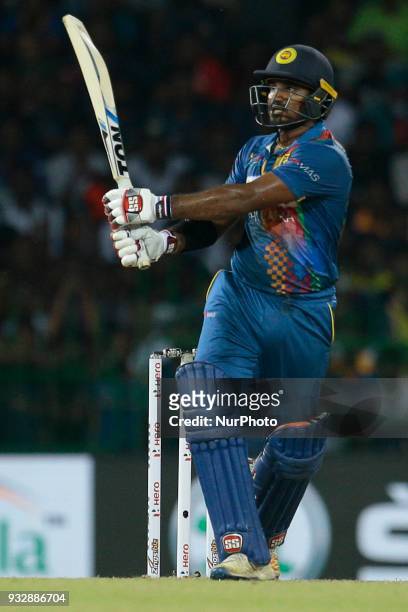 Sri Lankan cricketer Kusal Perera plays a shot during the 6th T20 cricket match of NIDAHAS Trophy between Sri Lanka and Bangladesh at R Premadasa...