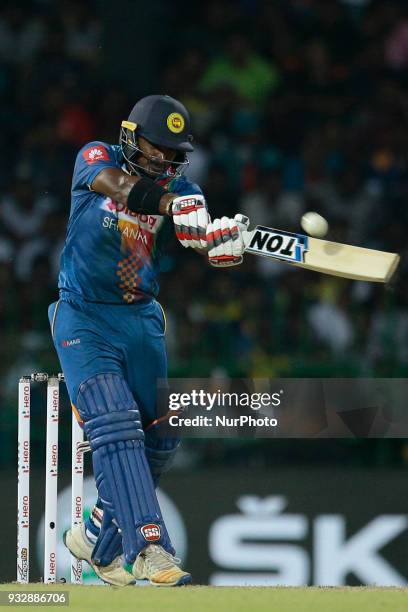 Sri Lankan cricketer Kusal Perera plays a shot during the 6th T20 cricket match of NIDAHAS Trophy between Sri Lanka and Bangladesh at R Premadasa...