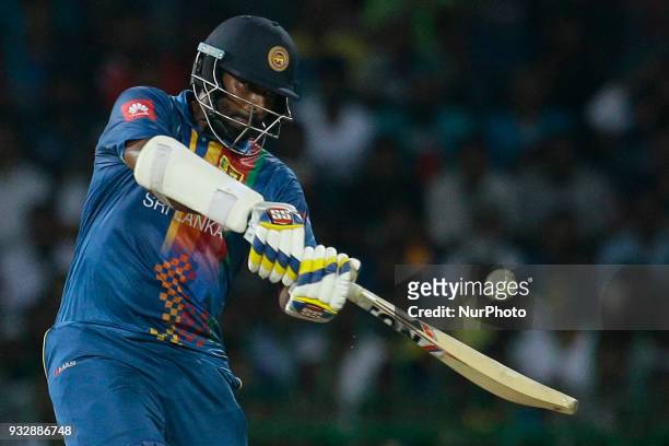 Sri Lankan cricket captain Thisara Perera plays a shot during the 6th T20 cricket match of NIDAHAS Trophy between Sri Lanka and Bangladesh at R...