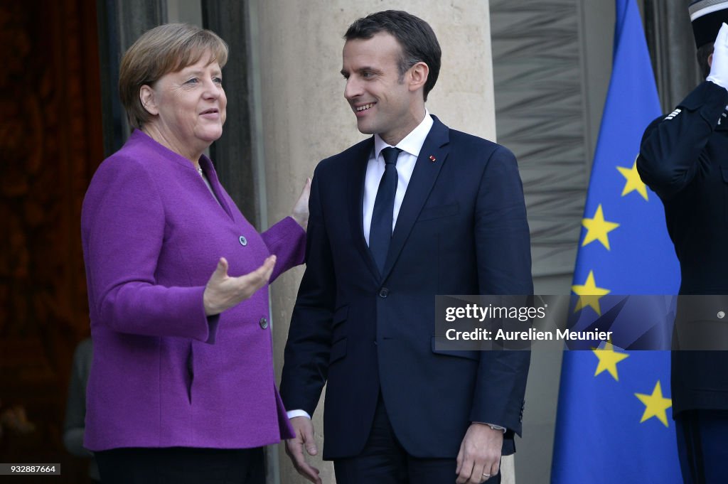 French President Emmanuel Macron Receives German Chancellor Angela Merkel At Elysee Palace in Paris