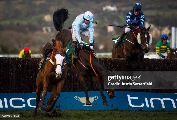 Some Plan riden by Noel Fehily falls at the last during the Johnny Henderson Grand Annual Challenge Cup Handicap Chase at the Cheltenham Festival -...