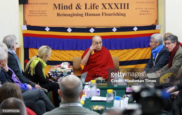 Tibetan spiritual leader, the Dalai Lama and fellow panellists during the last day of the morning session of the Mind and Life 33rd conference at the...