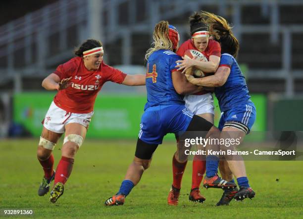 Wales' Mel Clay is tackled by France's Safi N'Diaye and Lise Arricastre during the Women's Six Nations Championships Round 5 match between Wales...