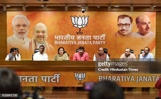 Delhi BJP chief Manoj Tiwari with Meenakshi Lekhi, Vijendra Gupta and other party leaders during a press conference for the ongoing sealing drive by...