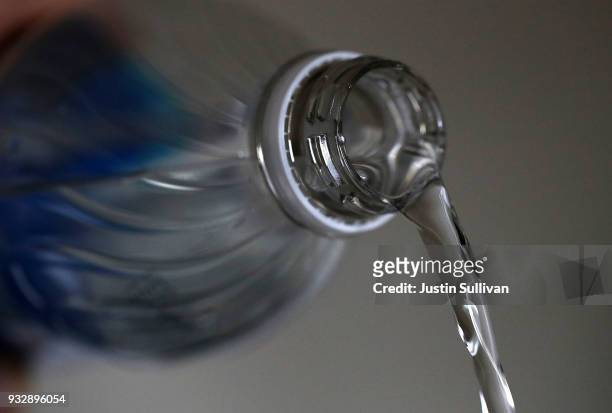 Bottles of water are displayed on March 16, 2018 in San Anselmo, California. A new study by State University of New York at Fredonia found that 93%...