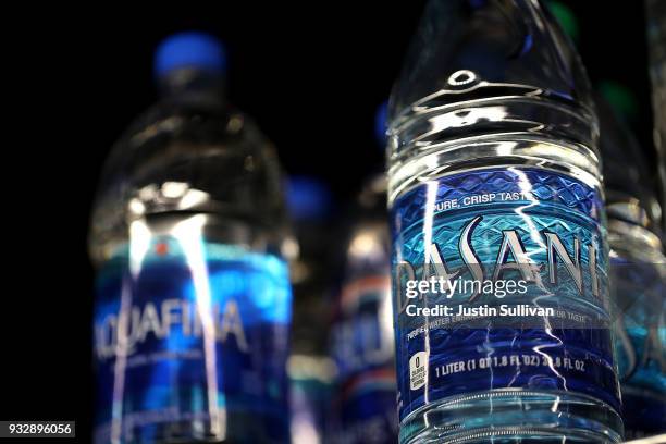 Bottles of water are displayed on a shelf at a convenience store March 16, 2018 in San Rafael, California. A new study by State University of New...