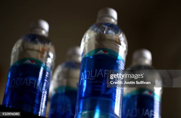 Bottles of Aquafina water are displayed on March 16, 2018 in San Anselmo, California. A new study by State University of New York at Fredonia found...