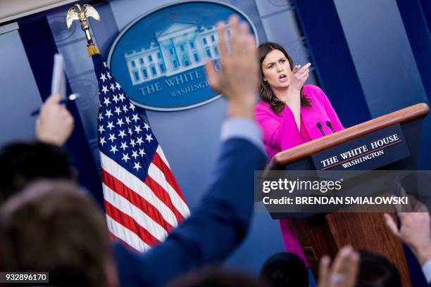 White House spokesperson Sarah Huckabee Sanders takes questions at the press briefing at the White House in Washington, DC, on March 16, 2018. / AFP...