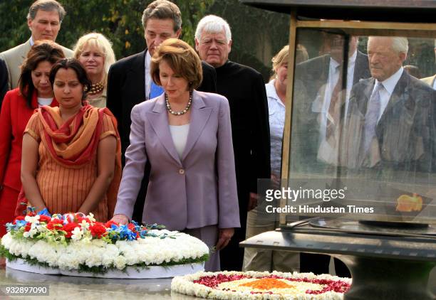 House Speaker Nancy Pelosi and others pays floral tribute at the memorial of Mahatma Gandhi, in New Delhi.
