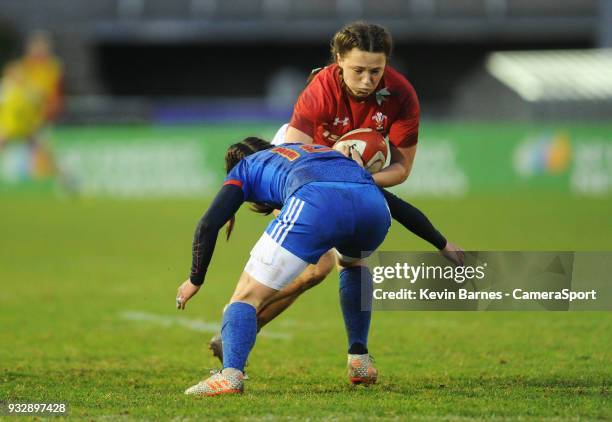 Wales' Alisha Butchers is tackled by France's Jade le Pesq during the Women's Six Nations Championships Round 5 match between Wales Women and France...