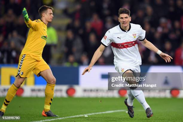 Mario Gomez of Stuttgart celebrates his team's first goal during the Bundesliga match between Sport-Club Freiburg and VfB Stuttgart at...