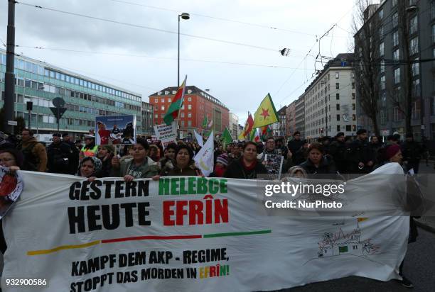 Protestors show flags of Rojava, YPG and YPJ. Hundreds of people demonstrated in Munich, Germany, on 16 March 2018 to remember the chemical attack of...