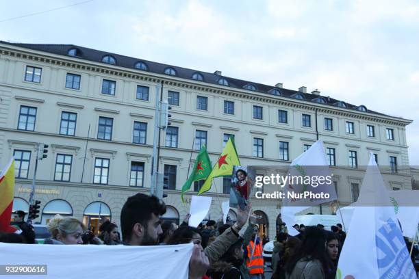 Protestors show pictures of dead children, the flags of the YPG, YPJ and PYD. Hundreds of people demonstrated in Munich, Germany, on 16 March 2018 to...