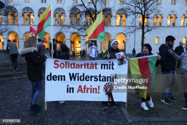 Banner demanding solidarity with the resistance in Afrin. Hundreds of people demonstrated in Munich, Germany, on 16 March 2018 to remember the...