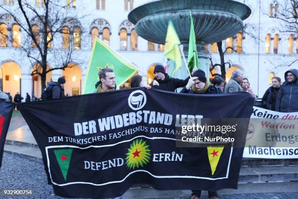 Banner saying ' the resistance lives / stop the turkish fascism / defend Afrin'. Hundreds of people demonstrated in Munich, Germany, on 16 March 2018...