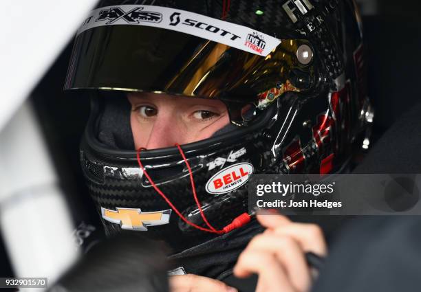 John H. Nemechek, driver of the Fire Alarm Services Inc. Chevrolet, prepares to climb into his car during practice for the NASCAR Xfinity Series...