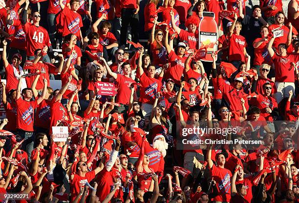 Fans of the Arizona Wildcats cheer before the college football game against the Oregon Ducks at Arizona Stadium on November 21, 2009 in Tucson,...