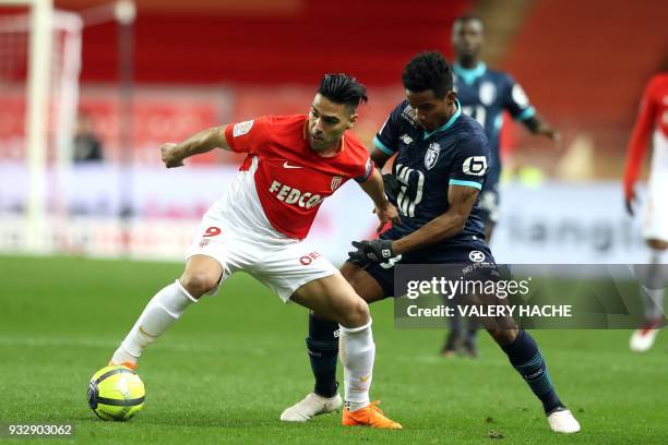 Monaco's Colombian forward Radamel Falcao vies with Lille's Brazilian forward Thiago Mendes during the French L1 football match Monaco vs Lille on...