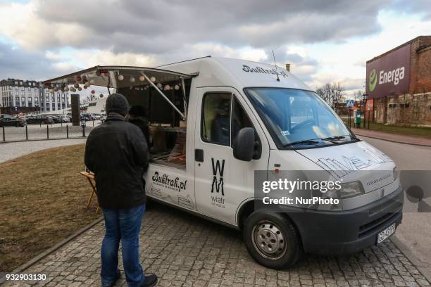 Mr. Michal Alenowicz owner of the Wind from the Sea publishing house is seen selling books in his Fiat Ducato Book Truck in Gdansk, Poland on 16...