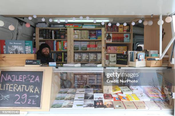 Mr. Michal Alenowicz owner of the Wind from the Sea publishing house is seen selling books in his Fiat Ducato Book Truck in Gdansk, Poland on 16...