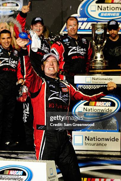 Kyle Busch, driver of the Z-Line Designs Toyota, celebrates in Victory Lane after winning the NASCAR Nationwide Series and the Ford 300 at...