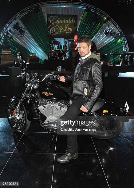 Keith Duffy of Boyzone helps to auction a Harley-Davidson motorbike during Ronan Keating's fourth annual Emeralds and Ivy Ball in aid of Cancer...