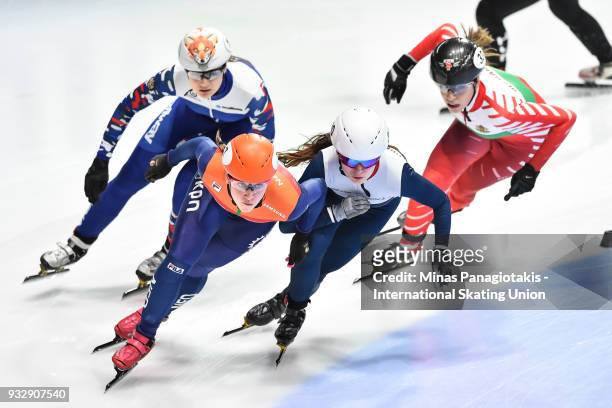 Suzanne Schulting of the Netherlands skates against Kathryn Thomson of Great Britain in the women's 500 meter heats during the World Short Track...