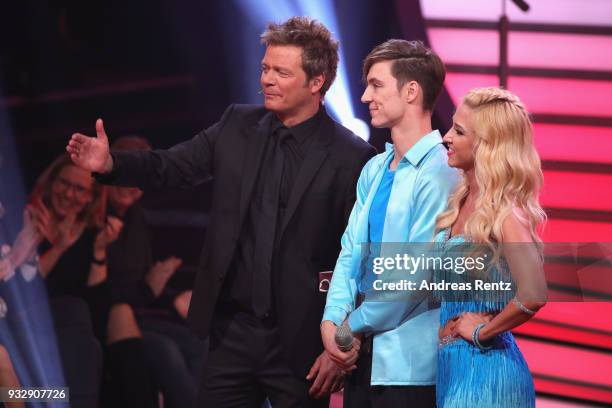 Oliver Geissen, Heiko Lochmann and Kathrin Menzinger on stage during the 1st show of the 11th season of the television competition 'Let's Dance' on...