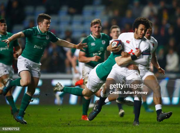 Jordan Olowofela of England is tackled by Michael Silvester of Ireland during the Natwest U20's Six Nations match between England U20 and Ireland U20...