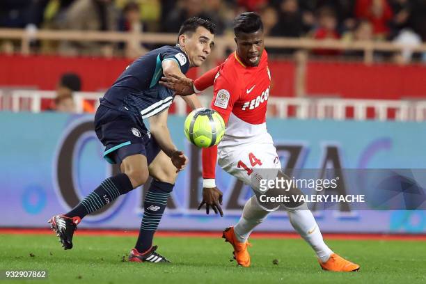 Lille's Paraguay defender Junior Alonso vies with Monaco's Spanish forward Keita Balde during the French L1 football match Monaco vs Lille on March...