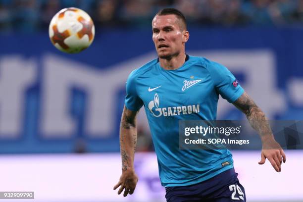 Anton Zabolotny of FC Zenit Saint Petersburg vie for the ball during the UEFA Europa League Round of 16 2nd leg football match between FC Zenit Saint...