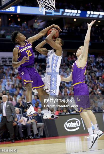 Kenny Cooper of the Lipscomb Bisons defends Kenny Williams of the North Carolina Tar Heels during the first round of the 2018 NCAA Men's Basketball...