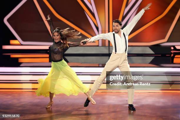 Jimi Blue Ochsenknecht and Renata Lusin perform on stage during the 1st show of the 11th season of the television competition 'Let's Dance' on March...