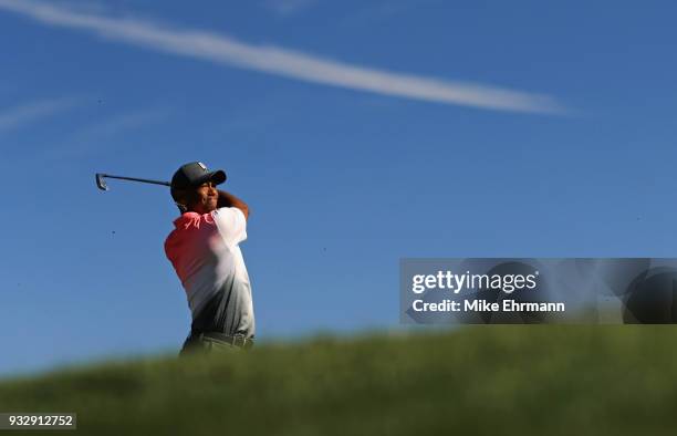 Tiger Woods plays his shot from the 14th tee during the second round at the Arnold Palmer Invitational Presented By MasterCard at Bay Hill Club and...