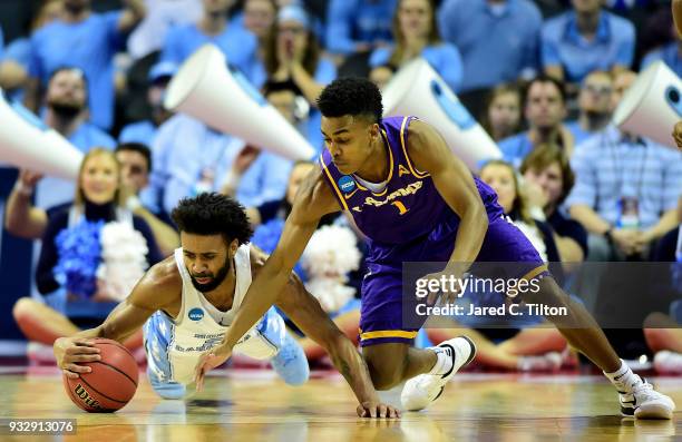 Joel Berry II of the North Carolina Tar Heels and Greg Jones of the Lipscomb Bisons dive for the ball during the first round of the 2018 NCAA Men's...