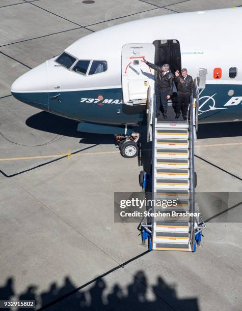 Boeing test pilots Jim Webb, left, and Keith Otsuka greet a crowd after completing the first flight of the Boeing 737 MAX 7, on March 16, 2018 in...